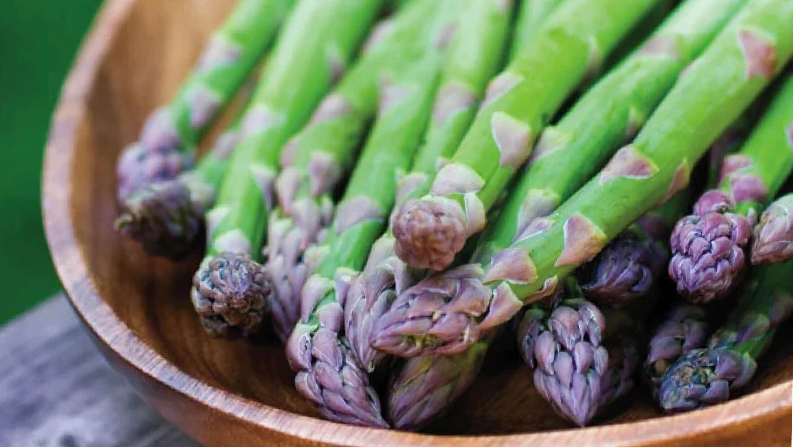 Asparagus in a wooden bowl.
