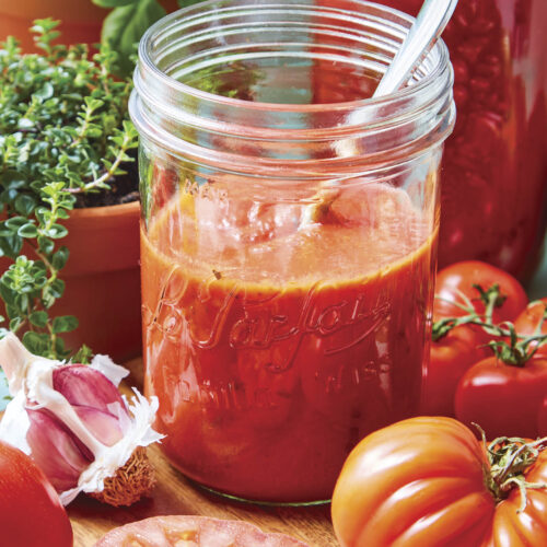 Making tomato passata with fresh tomatoes, garlic and rosemary.