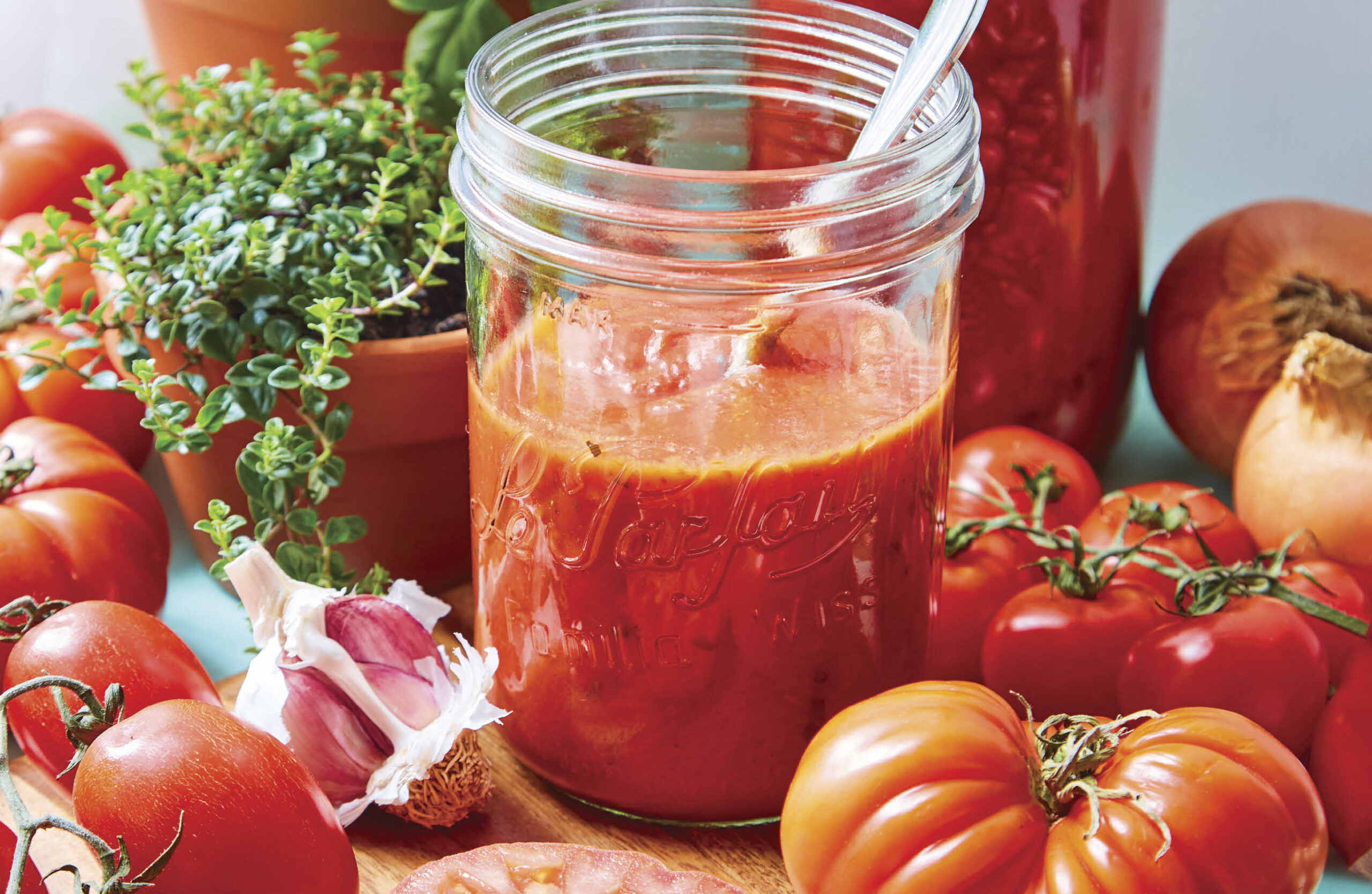 Making tomato passata with fresh tomatoes, garlic and rosemary.