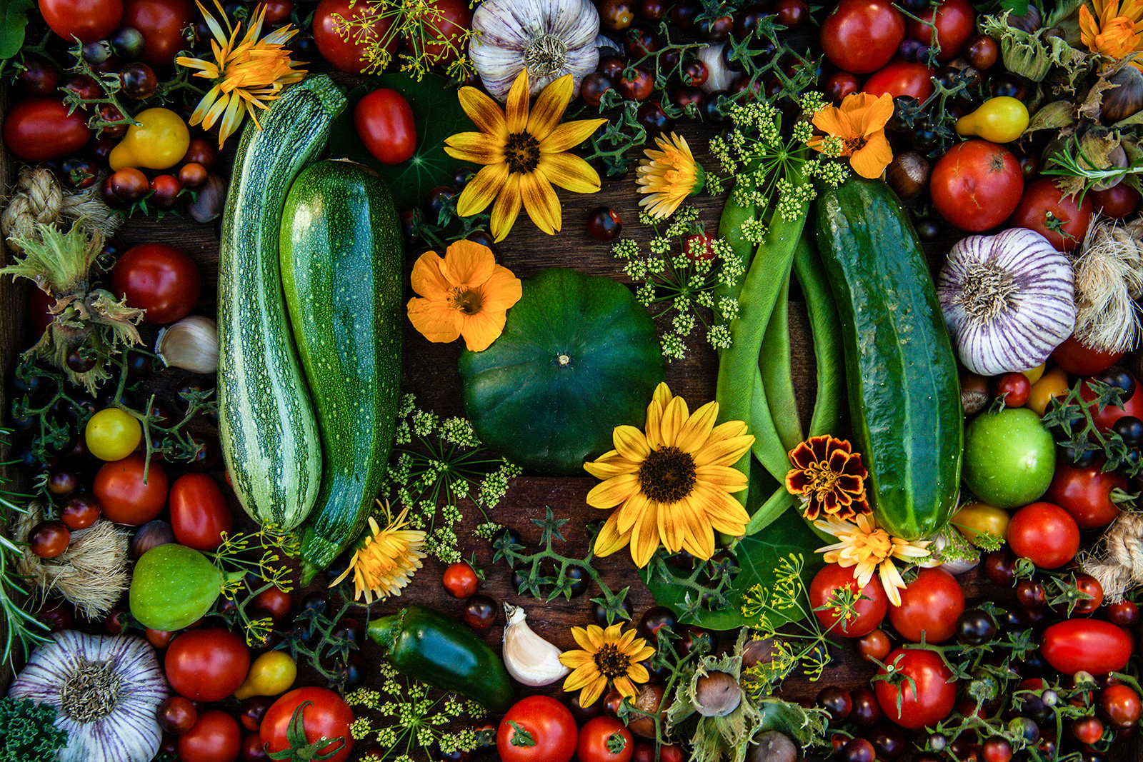 A collection of edible vegetables and flowers.