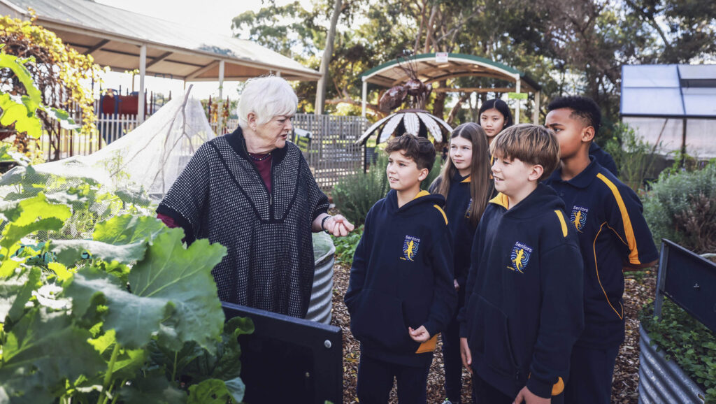 Stephanie Alexander with Kilkenny Primary School students in their kitchen garden.