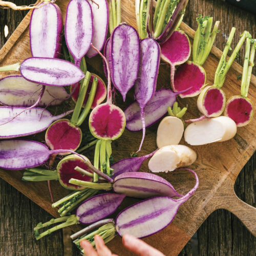 Radishes chopped in half ready for cooking.