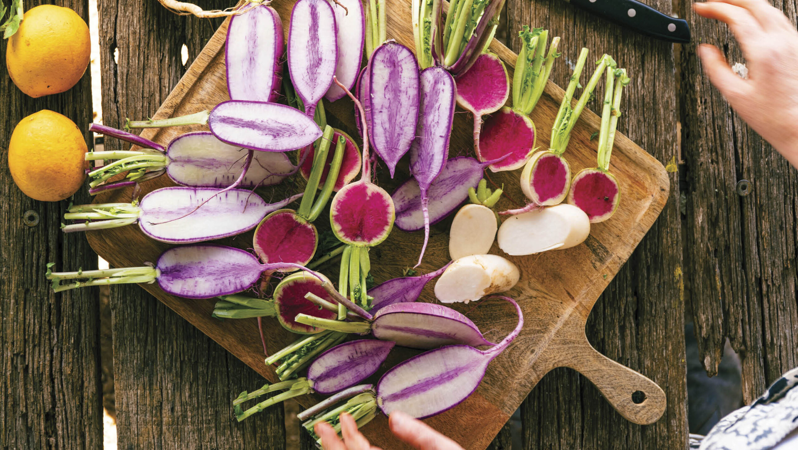 Radishes chopped in half ready for cooking.