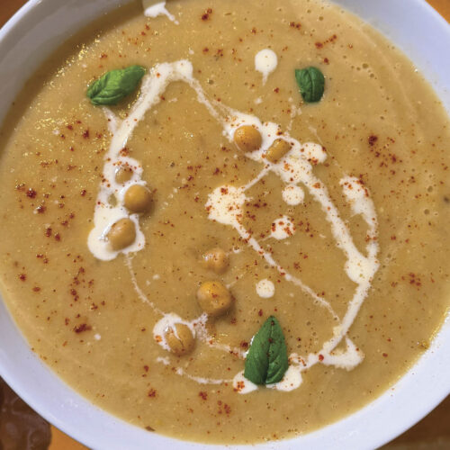 A bowl of cauliflower and chickpea soup.