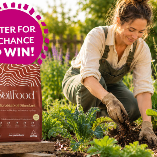 Women in garden beside a bag of SoilFood soil conditioner
