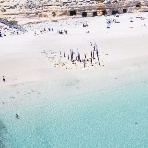 Aerial view of Port Willunga Beach and its historic jetty pylons