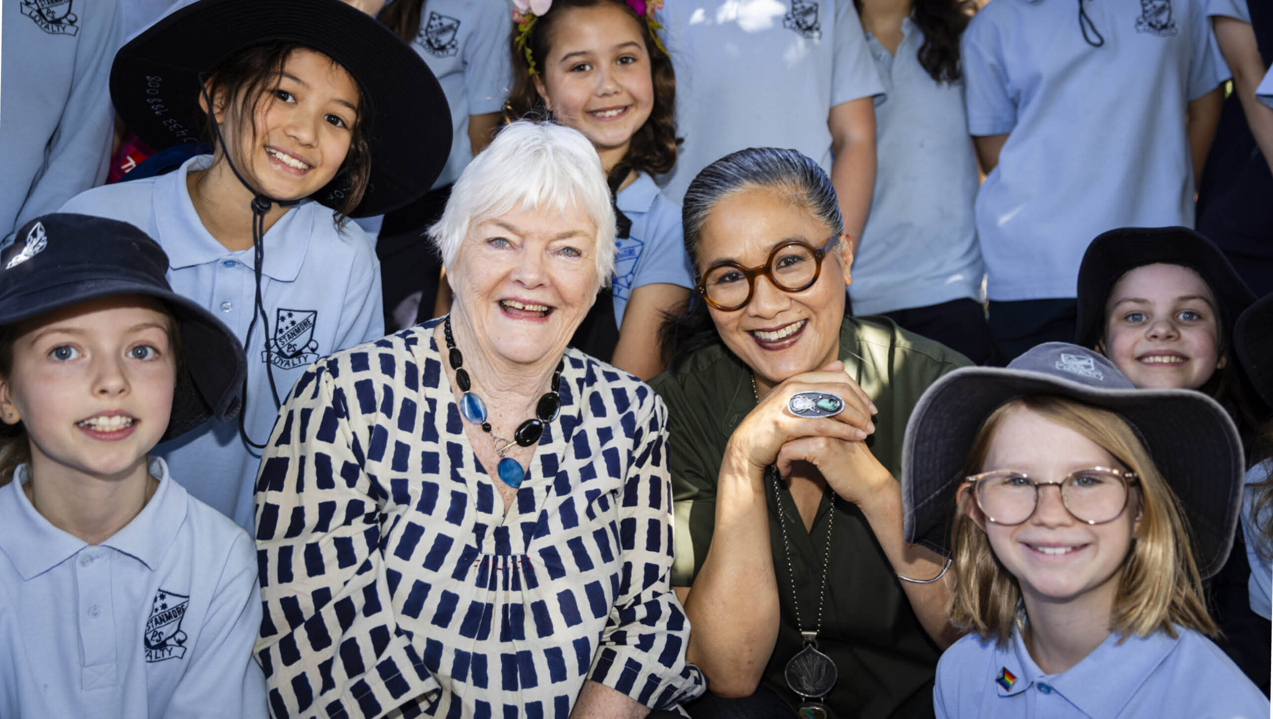 Stephanie Alexander and Kylie Kwong surrounded by Stanmore Public School students.